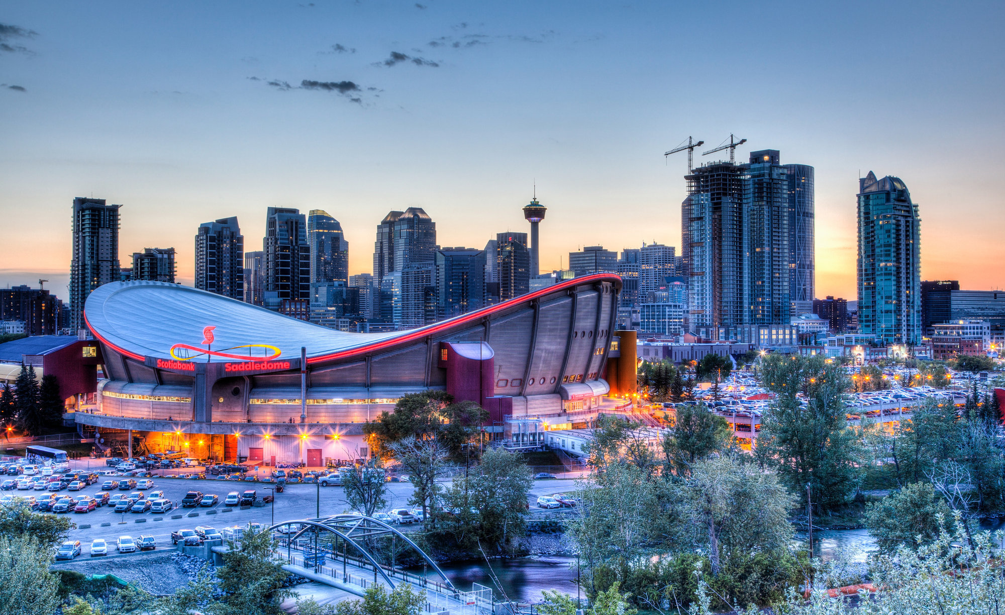The Calgary saddledome with downtown highrises in the background