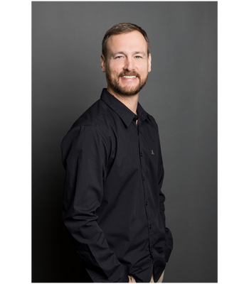 Portrait of Tyler Reeves, Realtor®/ Associate.